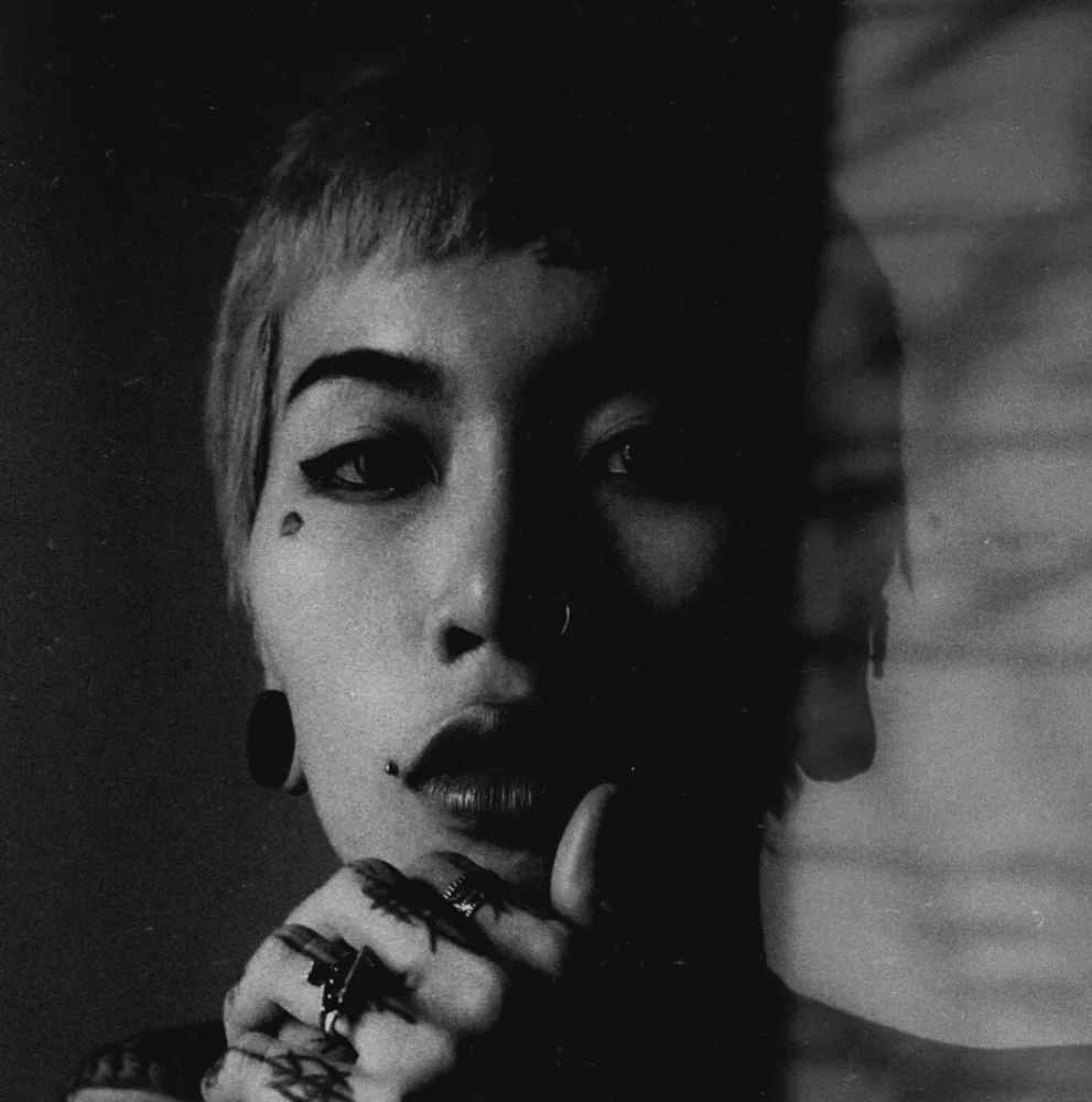 Black-and-white portrait of Gwen, female tattoo artist, Pattaya