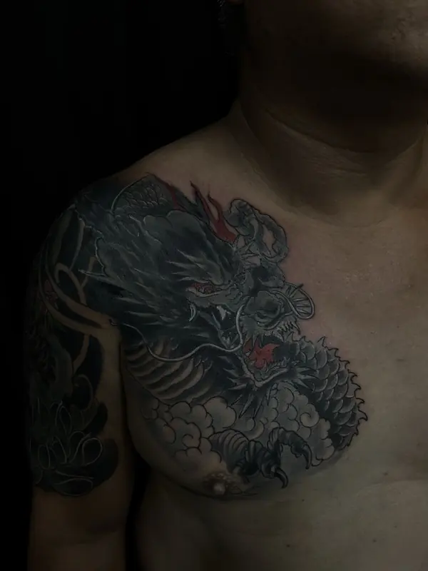 After: the tribal tattoo covered with a dark Japanese-style dragon by Gwen, Pattaya