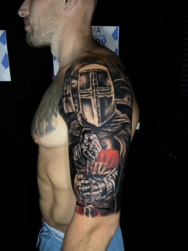 Realism tattoo by Gwen — knight portrait with colour accent