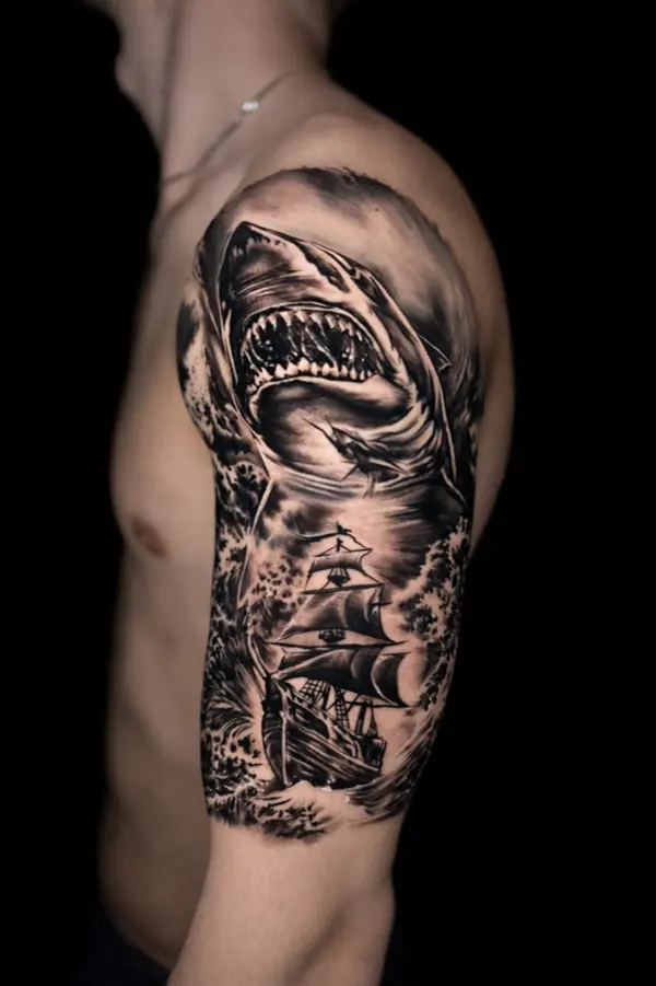 Realism tattoo by Gwen — shark and pirate ship sleeve, black and grey, Pattaya tattoo studio