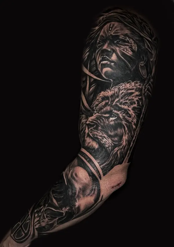 Realism tattoo by Gwen — woman portrait and lion full sleeve, black and grey, Pattaya tattoo studio