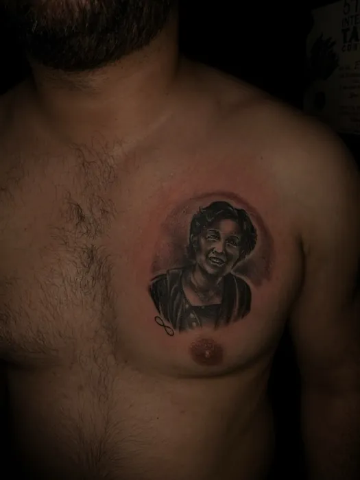 Realism tattoo by Gwen — small memorial portrait tattoo, black and grey, Pattaya tattoo studio