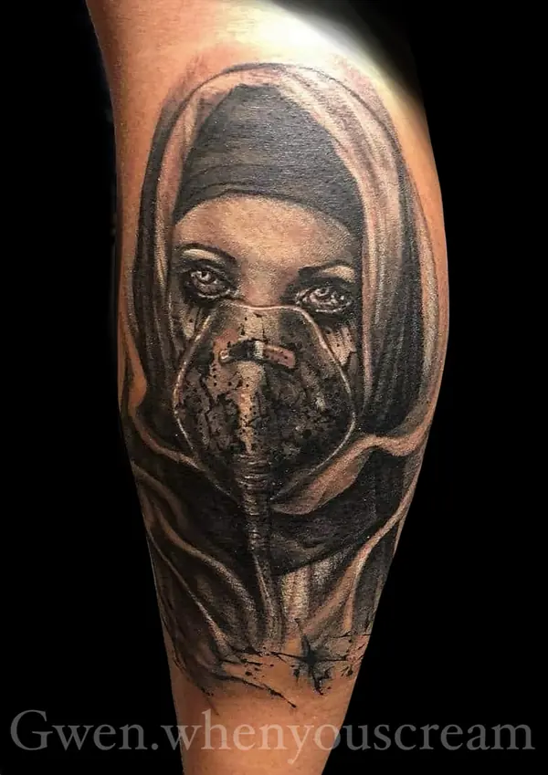Realism tattoo by Gwen — hooded portrait tattoo, black and grey